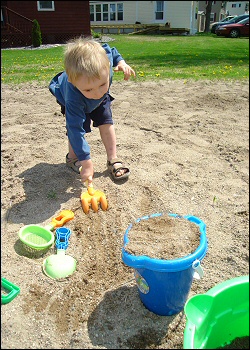 Photo of a child playing on the beach