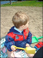 Photo of child playing in the sand