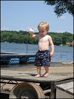 Photo of child playing on the dock