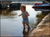 Photo of toddler playing in the water